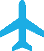 A blue airplane is on the ground in front of green.