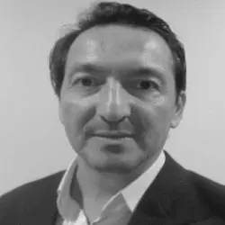 A black and white photo of a man in a suit.
